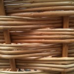 Close-up of bicycle basket showing 4-thick weaving strands around single risers