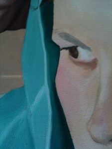 Detail of artist's face on towel background, showing angular points