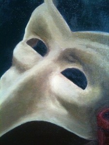 Close up of pale mask painted in oils