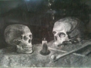 Two charcoal skulls, one missing the mandible, stare at a candle between them.