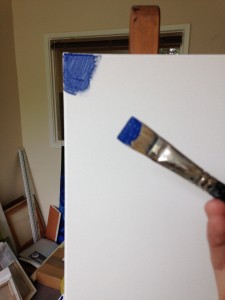 A small blue patch of oil paint on a very big canvas