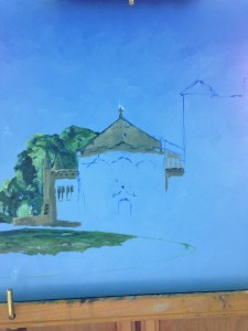 Partly painted chapel against a blue sky