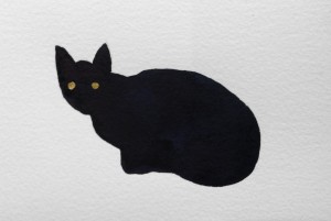 A black cat on a white background.  The cat has eyes made of gold leaf.